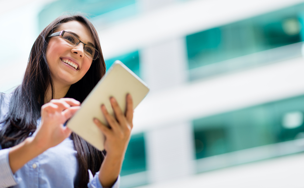 Successful business woman with a tablet computer